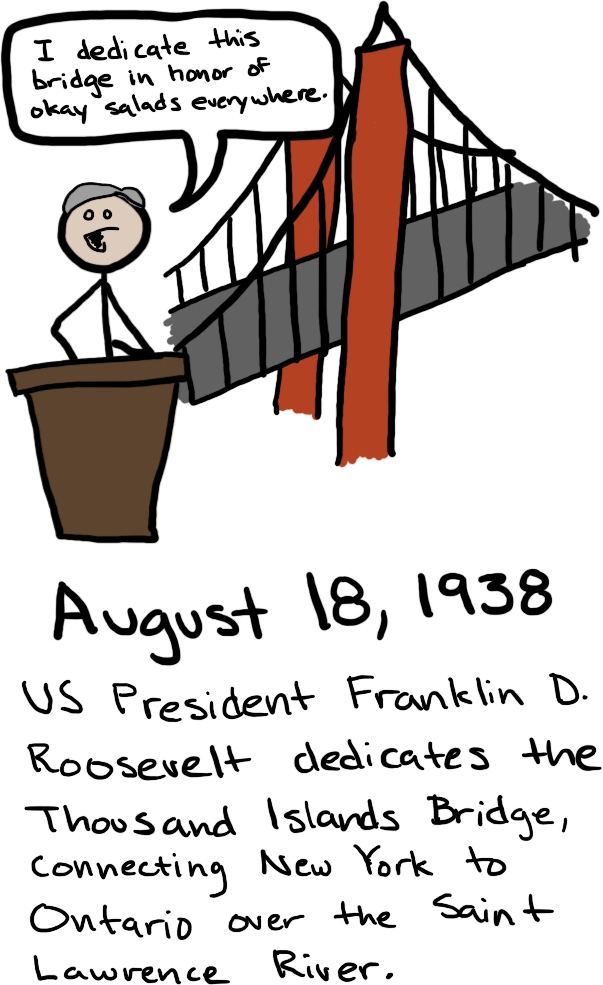A man stands behind a prodium in front of a bridge and says, 'I dedicate this bridge in honor of okay salads everywhere.